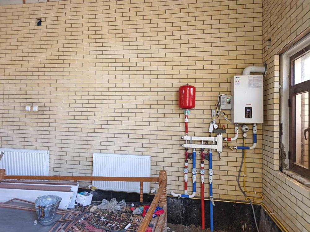 Xonadagi isitish tizimi: qozon, kollektor va radiatorlar